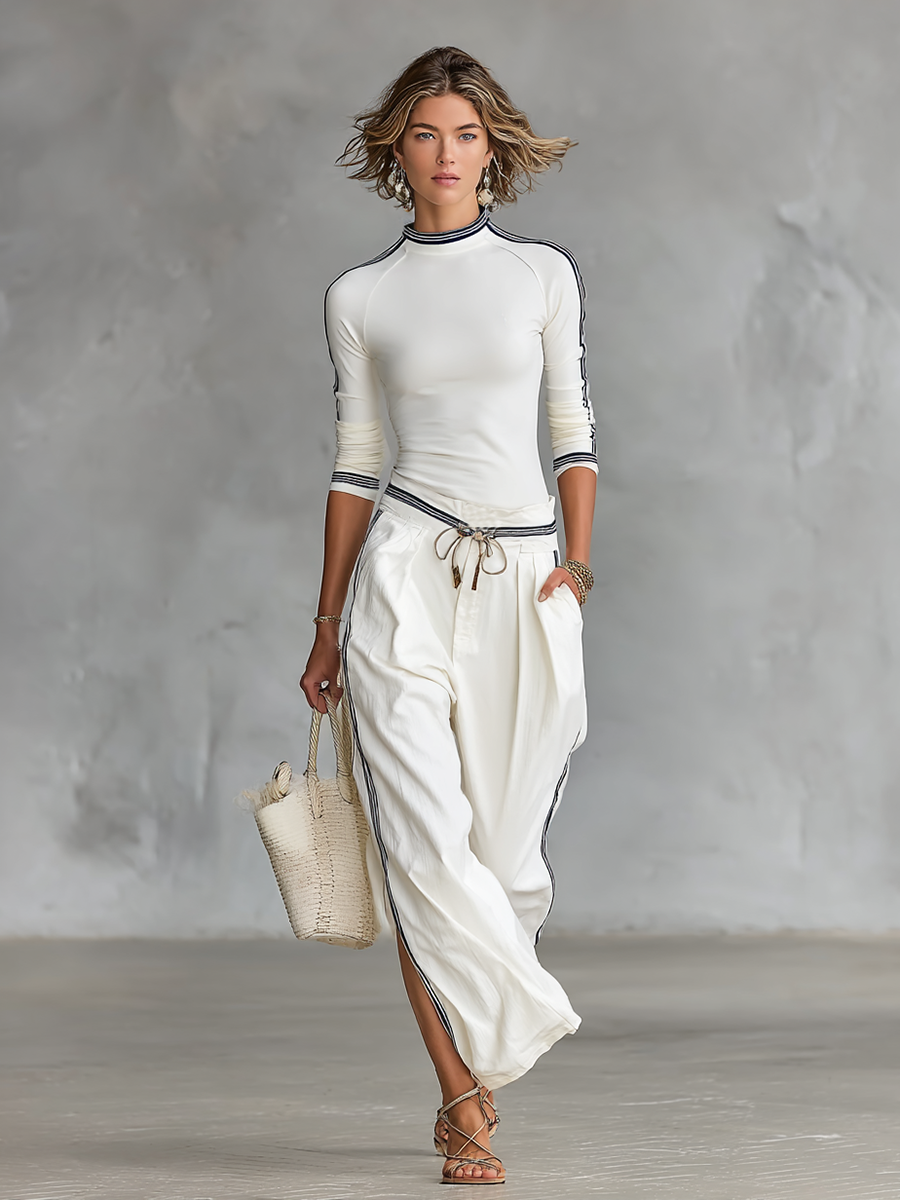 Maglietta lunga con colletto mezzo alto per donne e pantaloni larghi con cordino - set a due pezzi