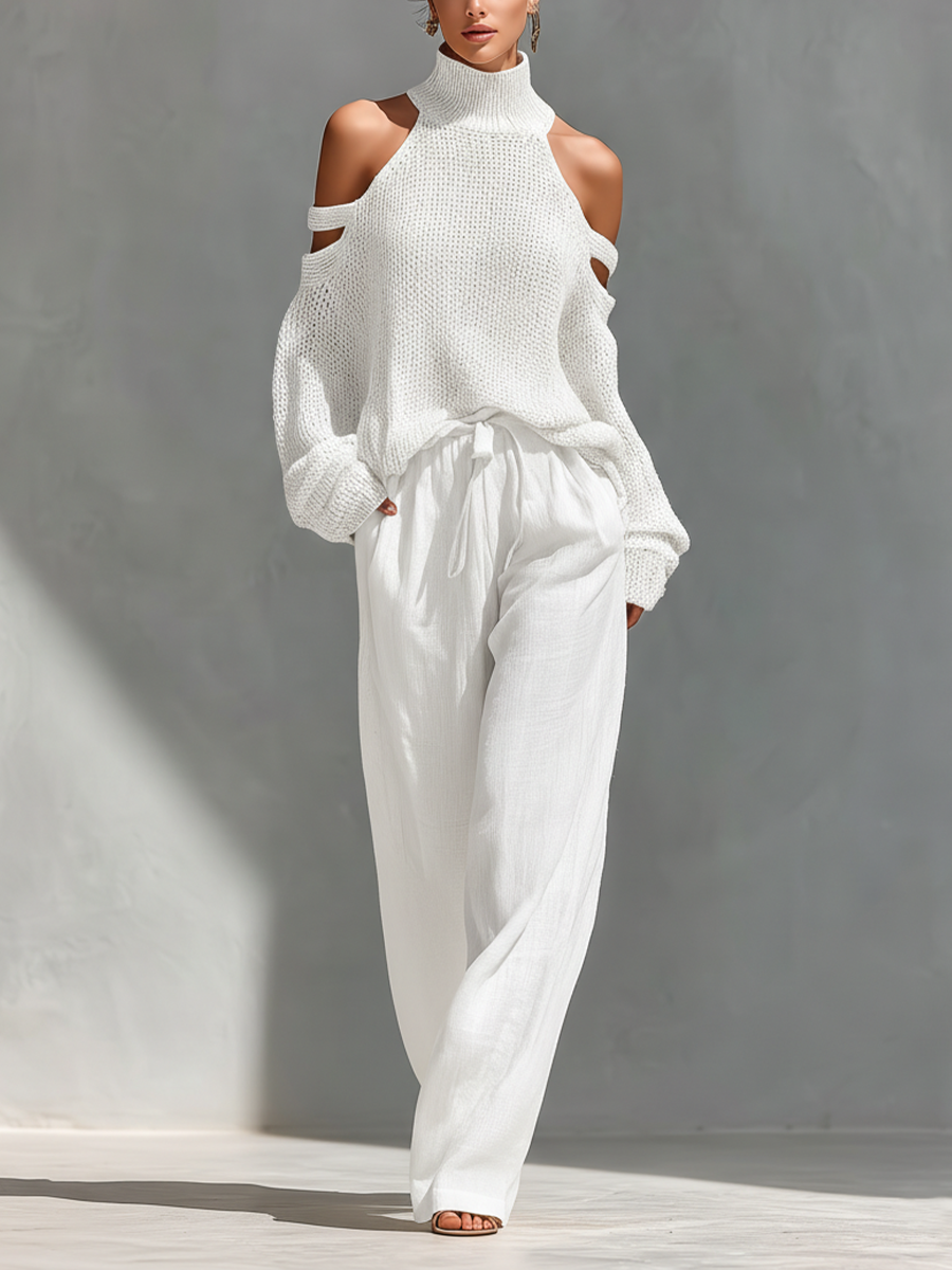 Set top con colletto alto e spalline fredde in cotone color beige e pantaloni larghi