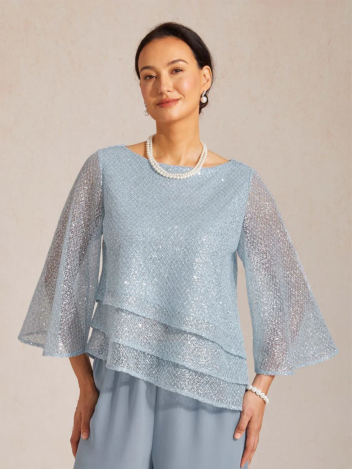Top a strati in rete con paillettes e maniche a campana