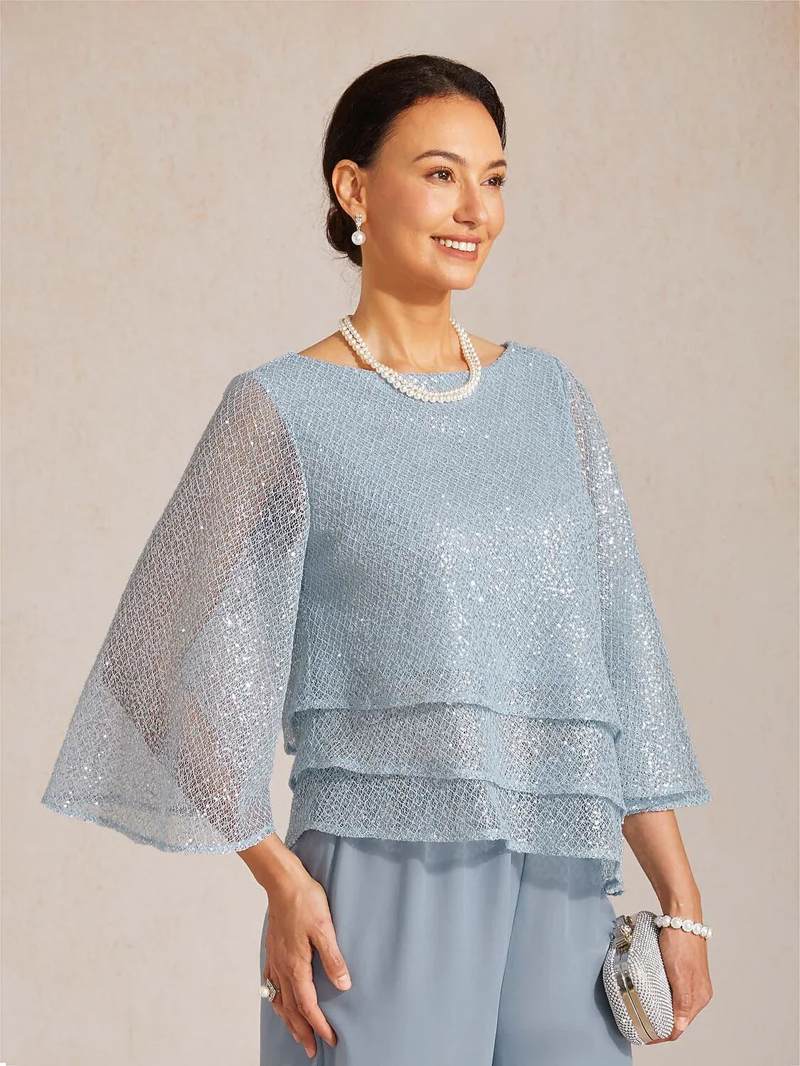 Top a strati in rete con paillettes e maniche a campana